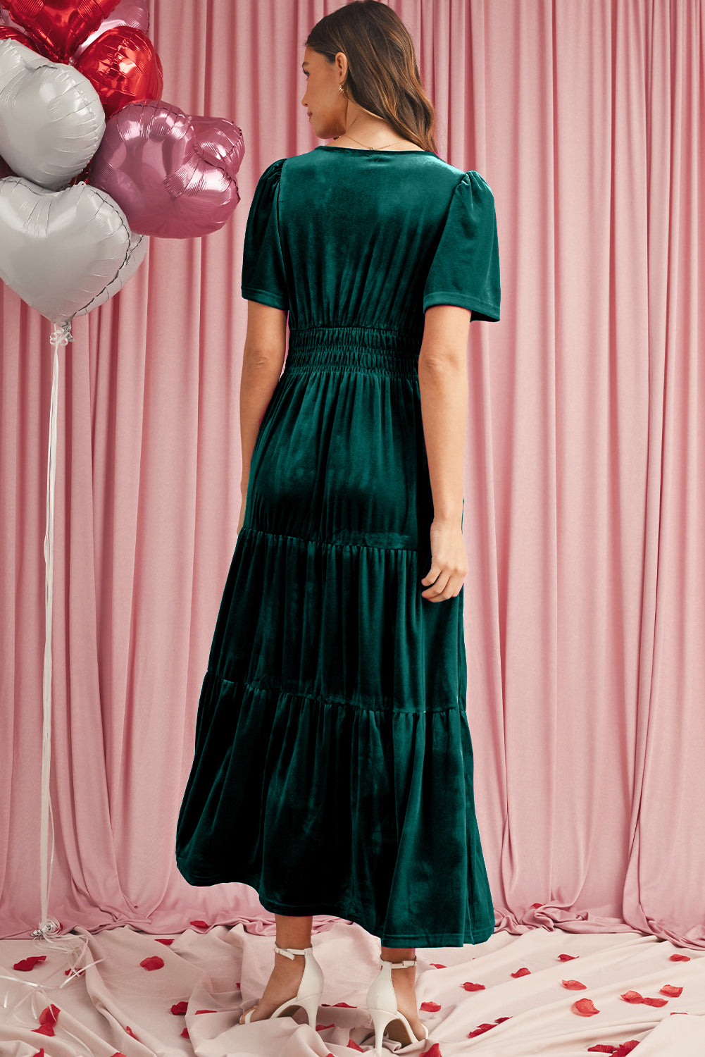 Back view of green velvet tiered maxi dress featuring elegant short sleeves
