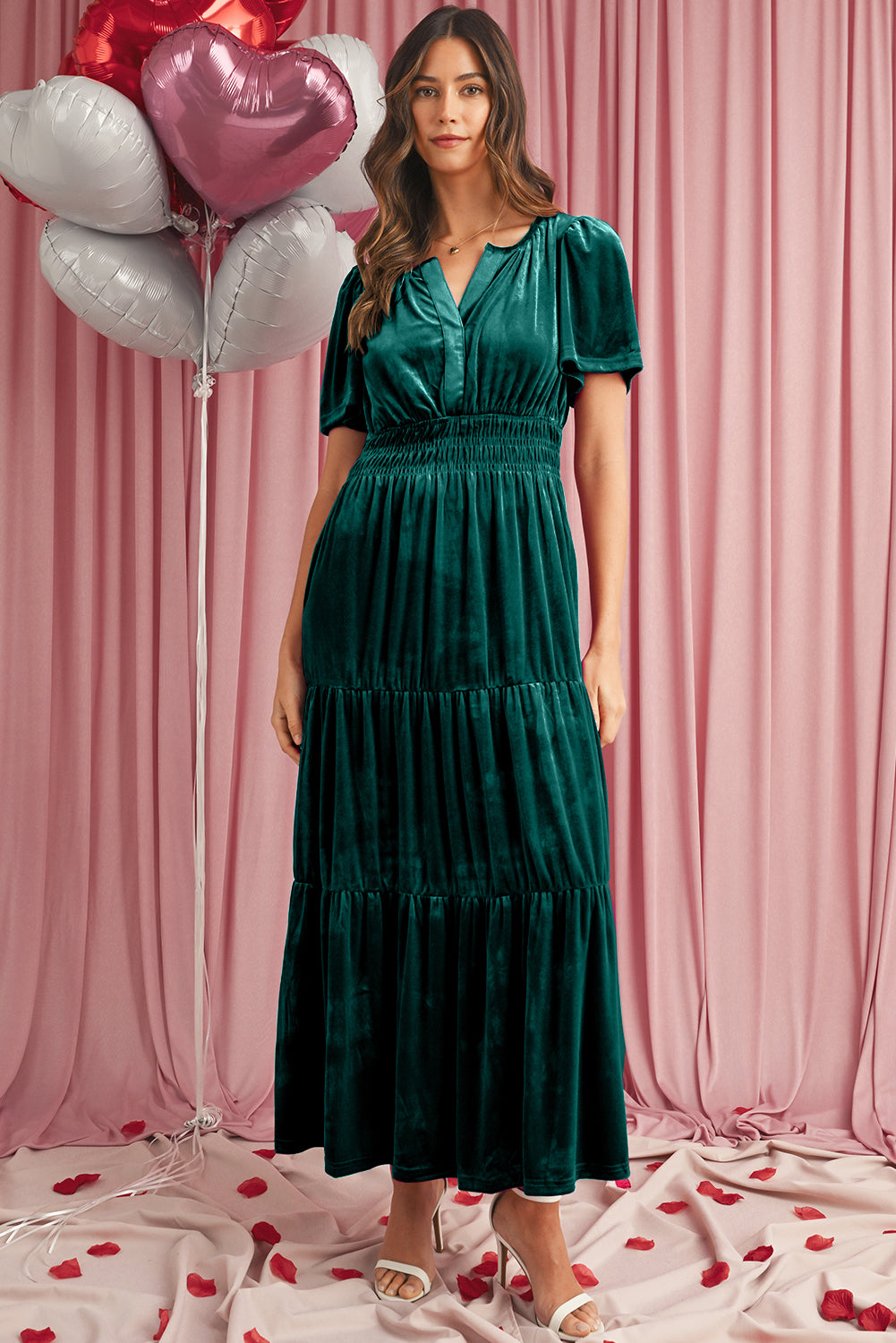 Front view of green velvet tiered maxi dress with shirred waist
