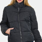 Versatile winter style with high-neck black puffer jacket
