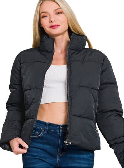 Front view of high-neck black puffer jacket with zipper closure
