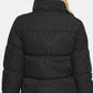 Winter layering with high-neck black puffer jacket for extra warmth
