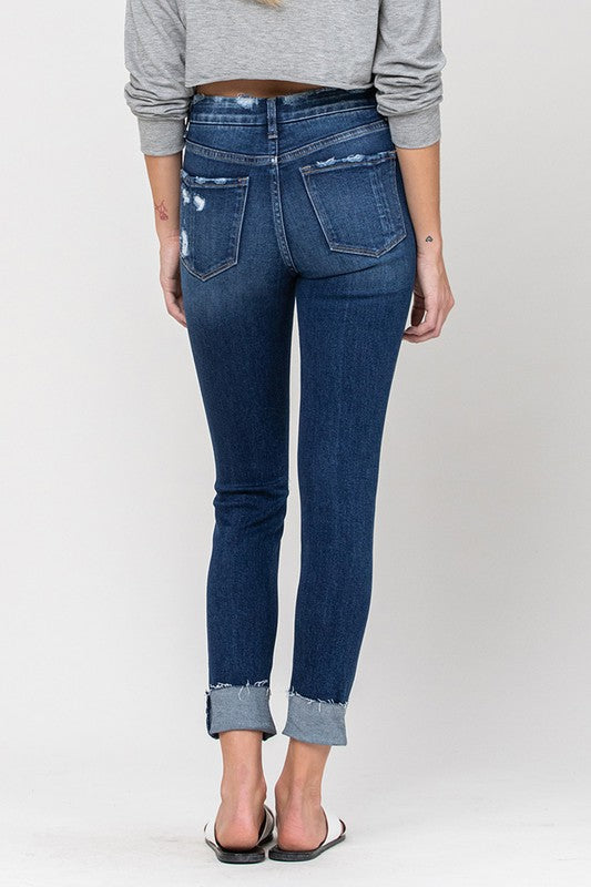 High-rise, crop skinny jeans with trendy distressed patches.
