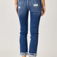 Medium-wash cuffed straight jeans with frayed hems for a laid-back look
