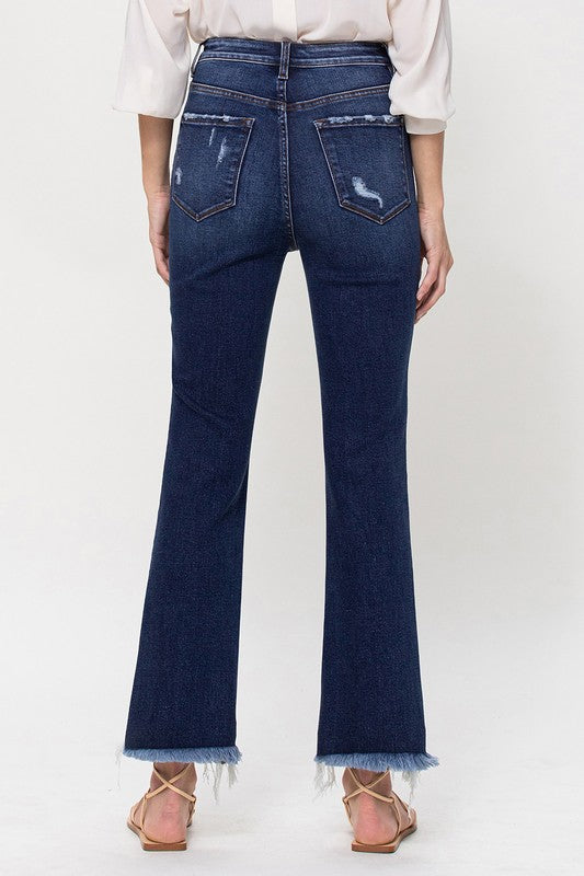 High-rise distressed kick flare jeans featuring a trendy flared silhouette.
