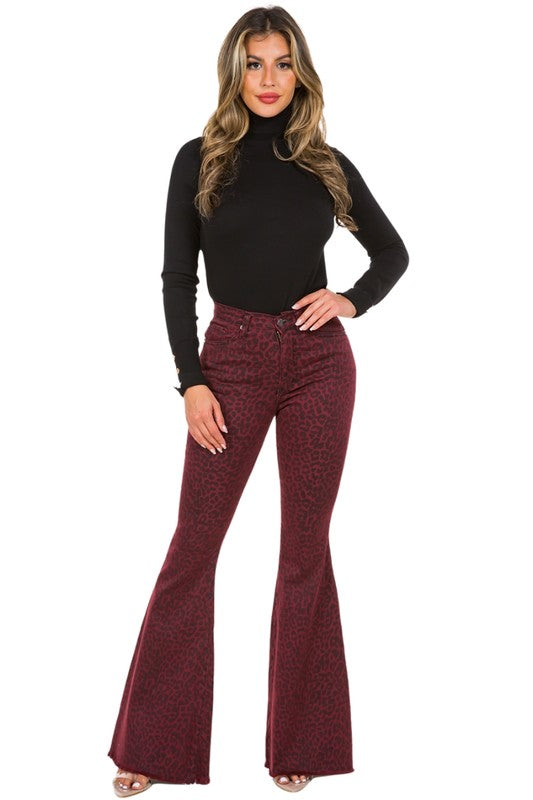 Front view of burgundy leopard print flared jeans with a high-rise fit.