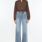 Slim-fit wide leg jeans with high waist and raw hem in light blue wash by Kancan.
