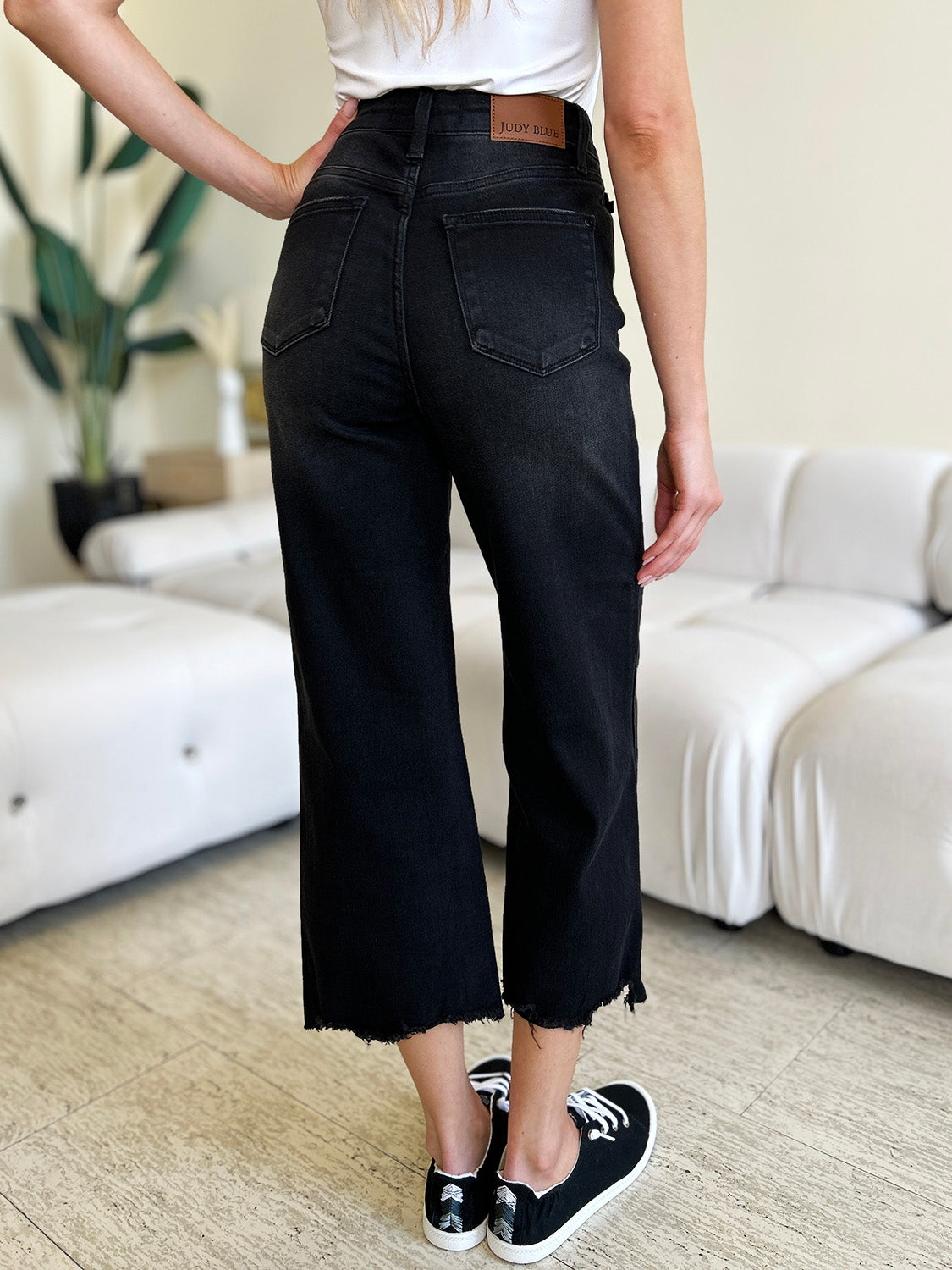 Cropped wide-leg denim with high waist and button fly.