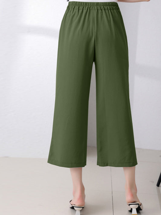 High-waisted cropped pants in a chic olive green color.