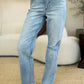 High-waisted distressed jeans with frayed hem by Judy Blue.