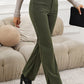 Textured fabric olive pants with a high-waist design.