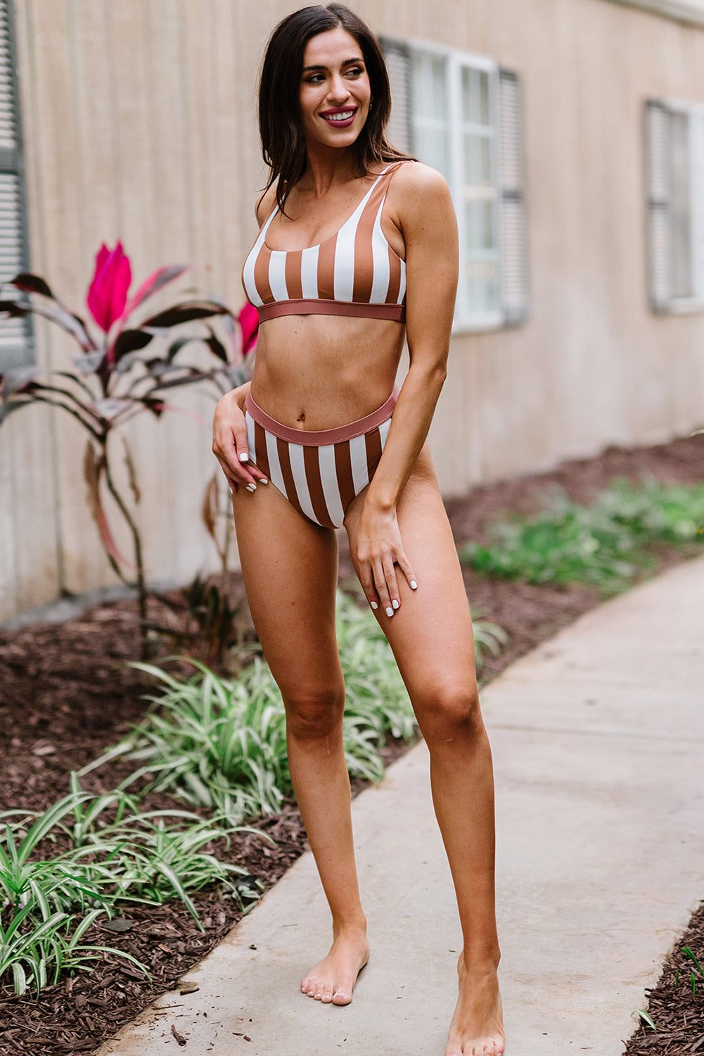 Chic striped high-waist bikini perfect for poolside or beach outings.
