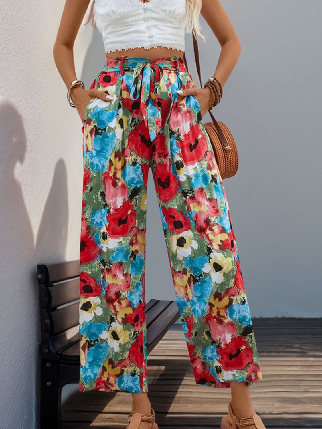 Tie-waist floral pants featuring bright floral pattern and pockets
