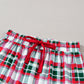 Holiday-themed plaid pajama set ideal for lounging or gift-giving.
