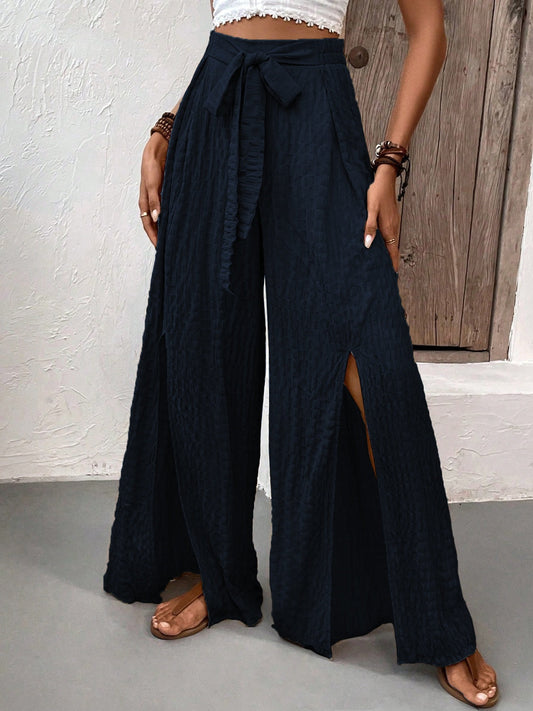 Black wide leg pants with high slits and adjustable tie waist
