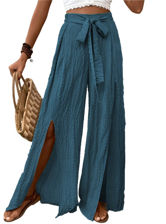 Turquoise wide leg pants with high slits and tie waist, front view