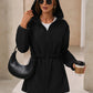 Stylish black womens rain jacket with waterproof fabric and an adjustable hood.
