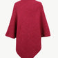 Women’s hot pink ribbed knit poncho with cozy turtleneck.
