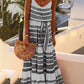 Elegant bohemian maxi dress with intricate tribal print, designed for a relaxed yet stylish look.