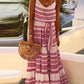 Women's bohemian maxi dress with spaghetti straps and flowy skirt, perfect for summer fashion