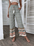 Lightweight bohemian wide-leg pants with a colorful print, ideal for casual wear.
