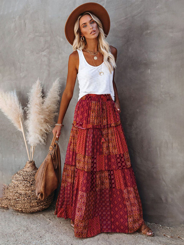 Red boho maxi skirt with elastic waistband and flowing tiers.