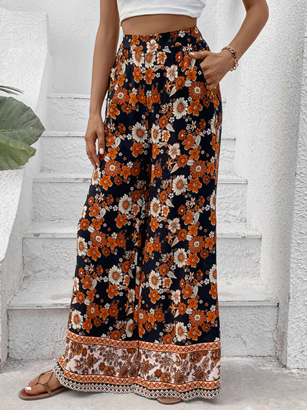 Woman in bohemian floral wide-leg pants, perfect for casual and beach outings.