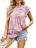 Detailed look at the bohemian floral pattern on a pink top.