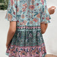 Back view of a Women's Bohemian Blouse highlighting the detailed floral print