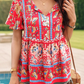 Vibrant floral Women's Bohemian Blouse paired with denim shorts