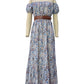 Casual bohemian off-shoulder maxi dress with a detailed paisley design, ideal for beach trips.