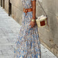 Elegant bohemian off-shoulder dress with a vintage paisley print, styled for a summer party.