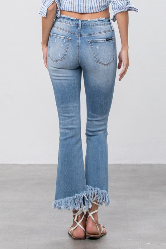 Back view of Insane Gene Mid-Rise Frayed Crop Flare Jeans with frayed hem.