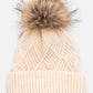 Ivory knit beanie with soft faux fur pom pom accent
