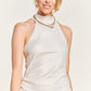 Ivory bodycon dress with a metallic sheen and flattering shirring.
