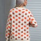 Back of the ivory fall leaf sweater showcasing the intricate autumn leaf pattern.