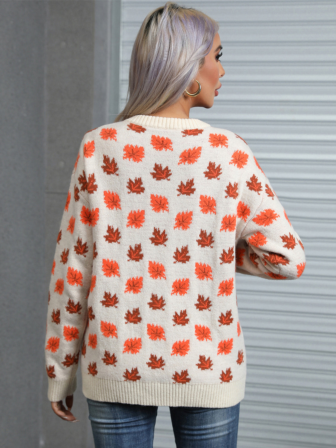 Back of the ivory fall leaf sweater showcasing the intricate autumn leaf pattern.