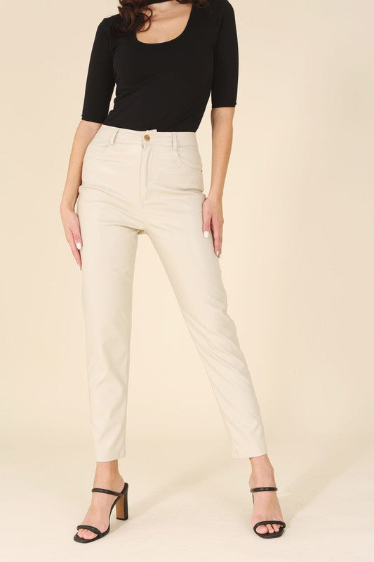 Front view of ivory vegan leather high-waisted pants styled for a polished outfit.
