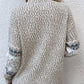 Ivory women’s snowflake knit sweater, perfect for festive gatherings and casual winter layering.

