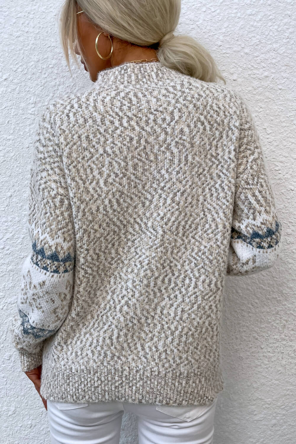 Ivory women’s snowflake knit sweater, perfect for festive gatherings and casual winter layering.

