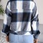 Stylish women’s plaid button-up jacket with a classic collared design.
