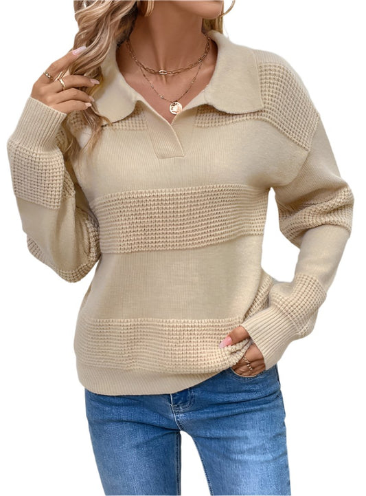 Woman wearing a Johnny Collar Dropped Shoulder Sweater in beige with light-wash jeans