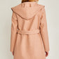 Back view of mauve fleece coat with hood and belted waist
