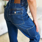 Judy Blue jeans with cargo pockets and logo patch, back view.