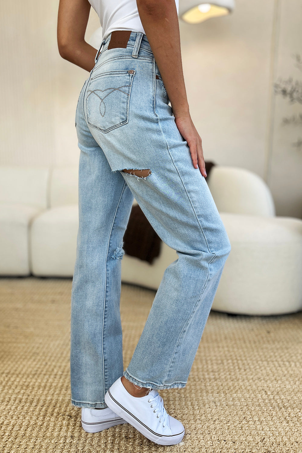 Side view of Judy Blue high waist distressed denim.