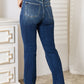 Judy Blue Mid-Rise Bootcut Jeans with Distressed Details.