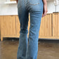 Trendy raw hem bootcut jeans by Judy Blue, perfect for casual or dressed-up outfits.