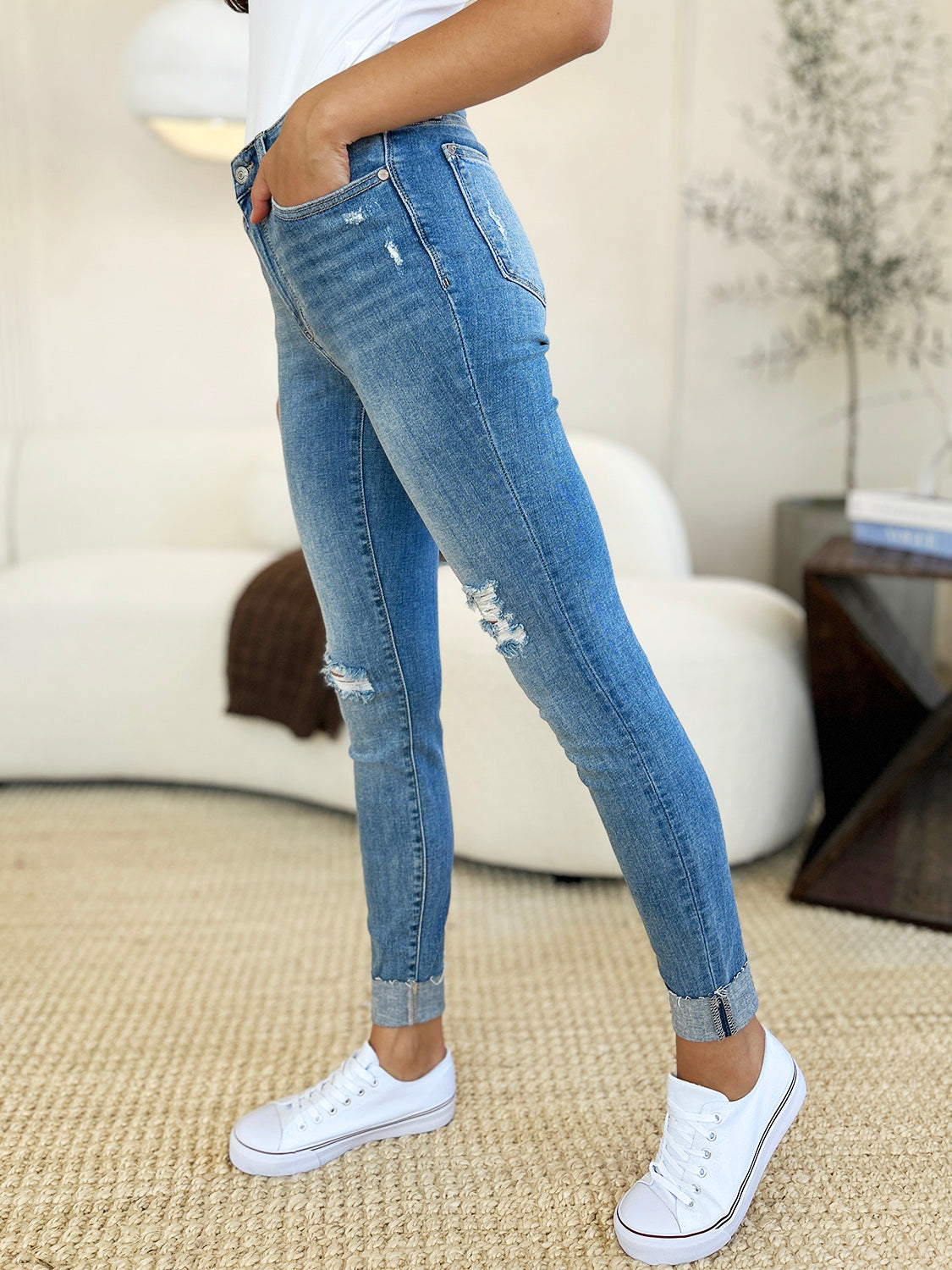 Focus on the front pocket design of Judy Blue Mid Rise Destroy & Cuff Skinny Jeans.