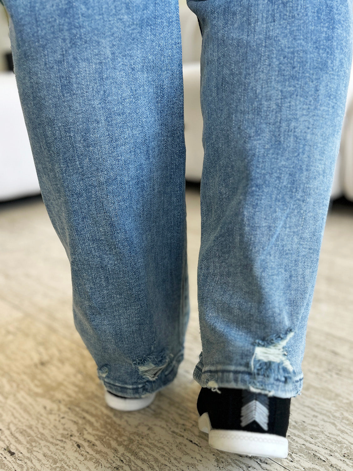 Back view of Judy Blue Mid Rise Distressed Straight Jeans showing the fit and distressing.