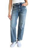 Model wearing Judy Blue Mid Rise Distressed Straight Jeans, showing the mid-rise fit.