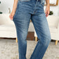 Women's mid-rise jeans by Judy Blue featuring a trendy release hem.
